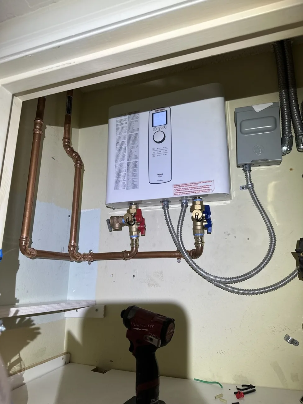 Tankless water heater with copper repipe